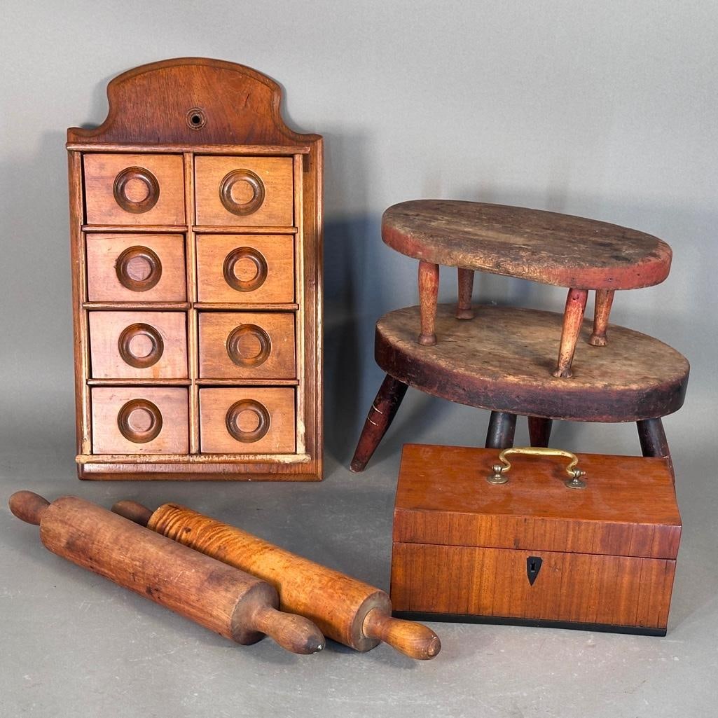Collection of Antique Decorative Wood Items: Group includes two antique 17"L rolling pins, two wood foot stools; 5"H with carved artists' signature underneath of G. Cummings and 7"H with turned feet., a locking mahogany box with brass handle,