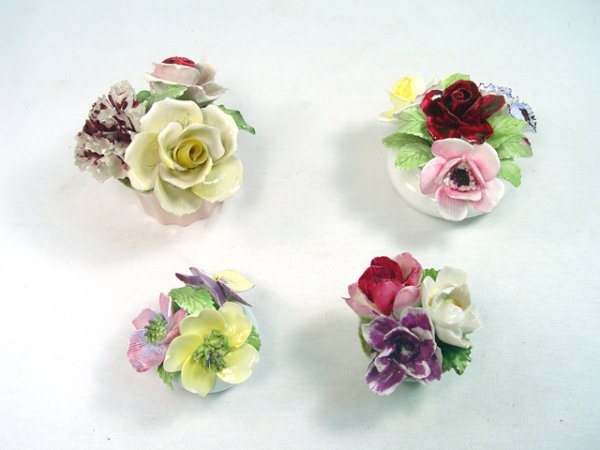 Group of 4 Porcelain Flowers.