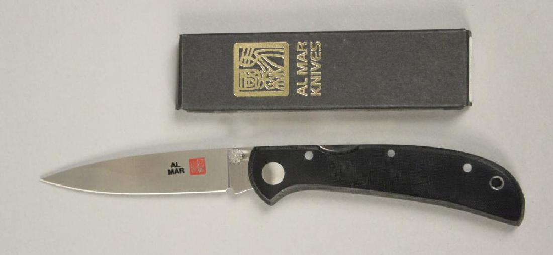 Al Mar Hawk Ultralight 6" Pocket Knife: Lockback Knife with Black Micarta Handle. Comes with Original Box. Stamped AUS - 8. Knife Measures Approximately 6", Blade Approximately 2 1/2". [JHI 296]