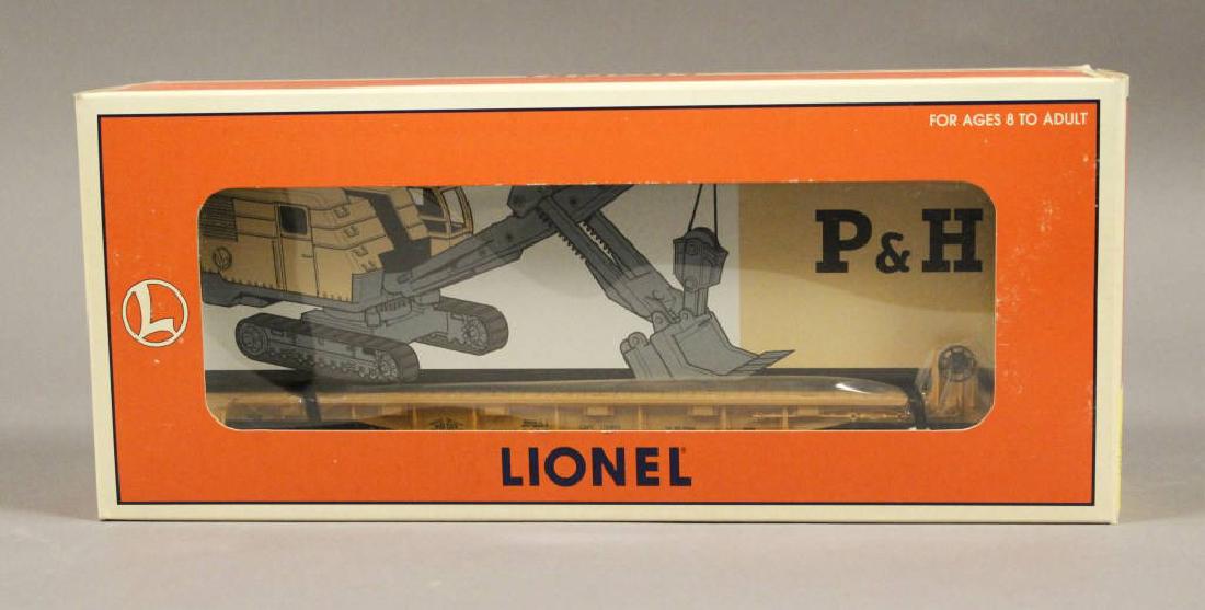 Lionel 6-16978 Milwaukee Flat Car w/Crane: Lionel 6-16978 Milwaukee Road Flatcar with P&H Power Shovel Model Kit. This car features die-cast metal sprung trucks, operating knuckle couplers, metal wheels and axles. - - - - Join our mailing list