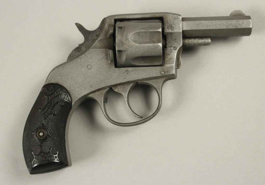 The American Double Action .32 Smith & Wesson: The American Double Action S&W. H & R Arms Co. Rough condition, for parts or repair. [LCA 3164]