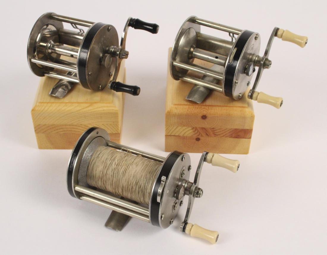 3 Shakespeare Casting Fishing Reels: Three Shakespeare casting reels including, a Majestic 1953 Model 31, a Surf Tournament 1756, and an Ideal Level Winding No. 1963. [JHI 435]
