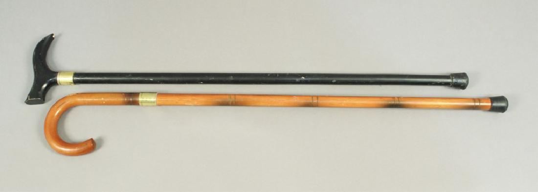 2 Walking Canes with Pull-out Swords: Includes a Tomahawk brand made in China and an K Exclusive brand cane sword made in China. [ILY 608]