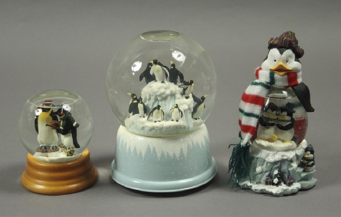 3 Collectible Penguin Snow Globes: Snow Globes include San Francisco Music Company Music Box, Edie Bauer snow globe and additional musical snow globe. Mr. Popper's Penguins. Happy Feet. March of the Penguins. The Penguins of Madagascar