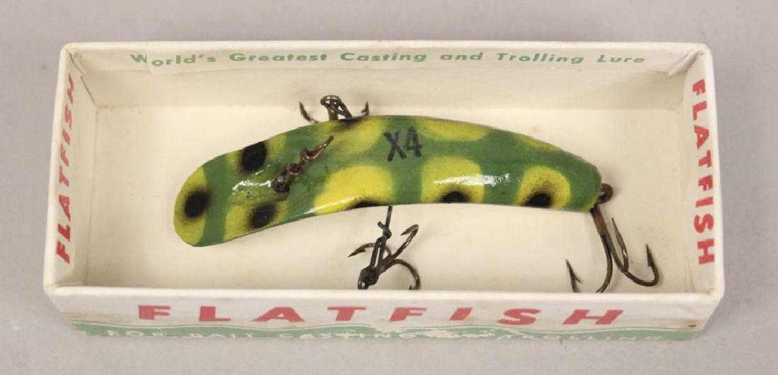 Helin Flatfish Frog Color Fishing Lure in the Box: The Helin Tackle Company started with creator Charles Helin, who was from Detroit, Michigan, in 1933. The designer invented a flatfish lure design, which he had patented in 1936. Helin claimed to have
