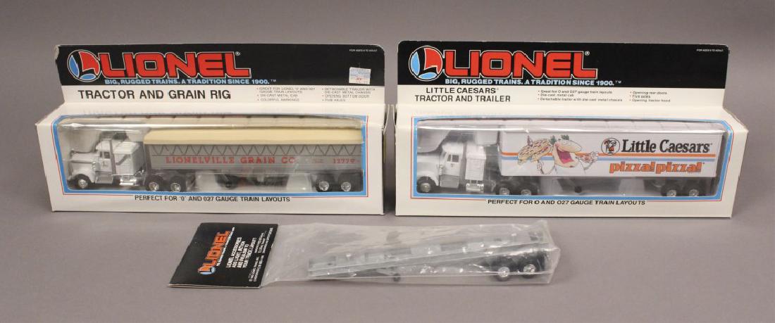 2 Lionel Tractor & Trailers 6-12779 & 6-12864: Lionel 6-12864 Little Caesar's Tractor & Trailer. Lionel 6-12779 Lionel Tractor & Grain Rig. [WNM L-A 6-12864]