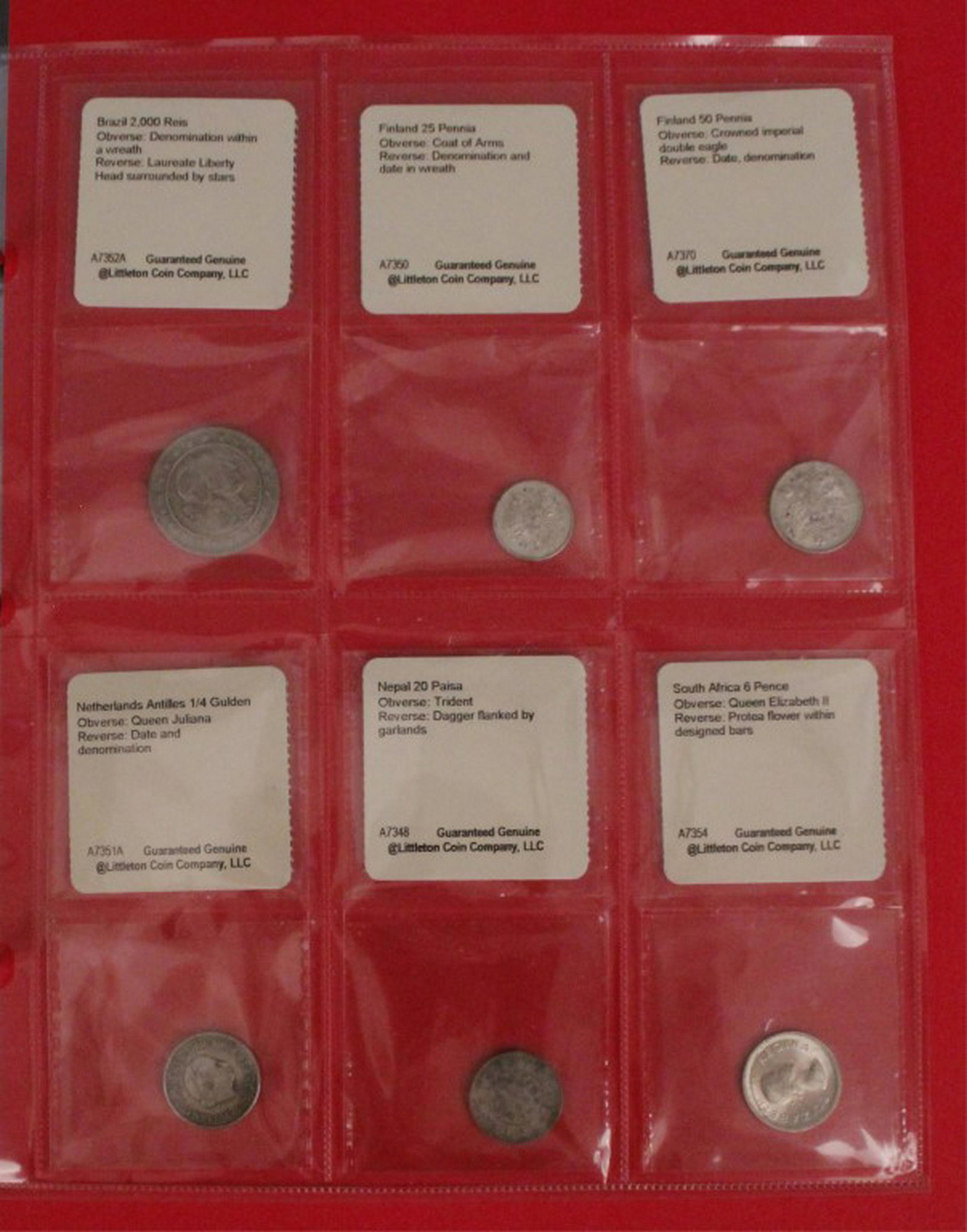 42 Foreign Silver Coins 1700s - 1970s: Portfolio Collection binder. 1701- 1793 2 Styvier Netherlands, 1923 -1938 - Lats Latvia, 1922-1938 - 50 Sen Japan. Mixed years & denominations. Littleton Coin Company. [KRE 120]