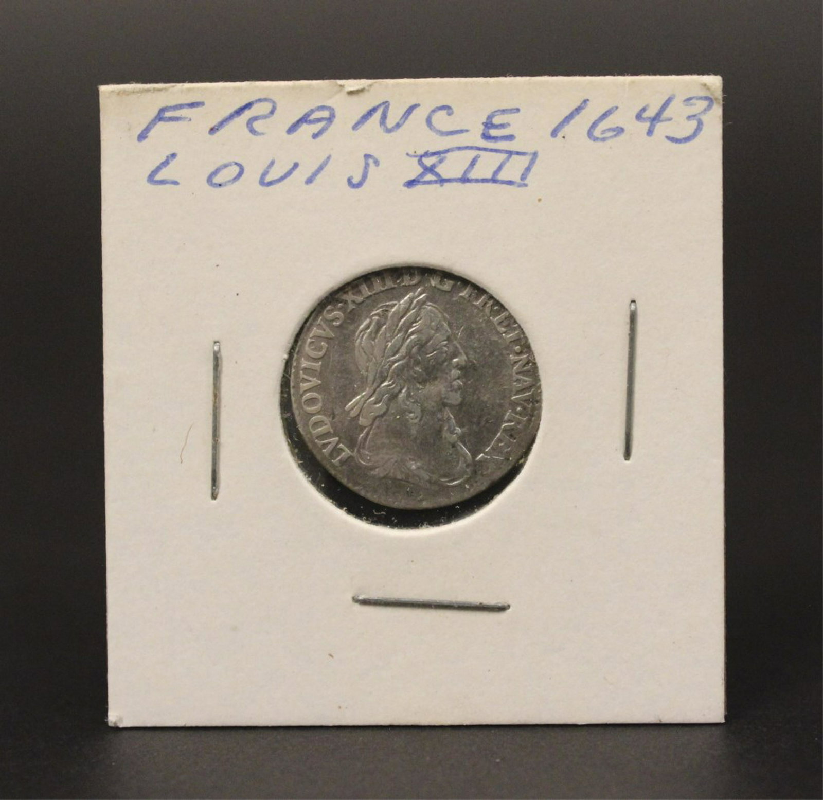 1643 France Louis XIII Silver 1/2 Louis D' Argent: Front of coin "LVD XIII DG – FR ET NAV REX" LVDOVICVS XIII DEI GRATIA FRANCIAE ET NAVARRAE REX "Louis XIII, by the grace of God king of France and of Navarre". Reverse of coin "SIT NOMEN DOMINI BENE