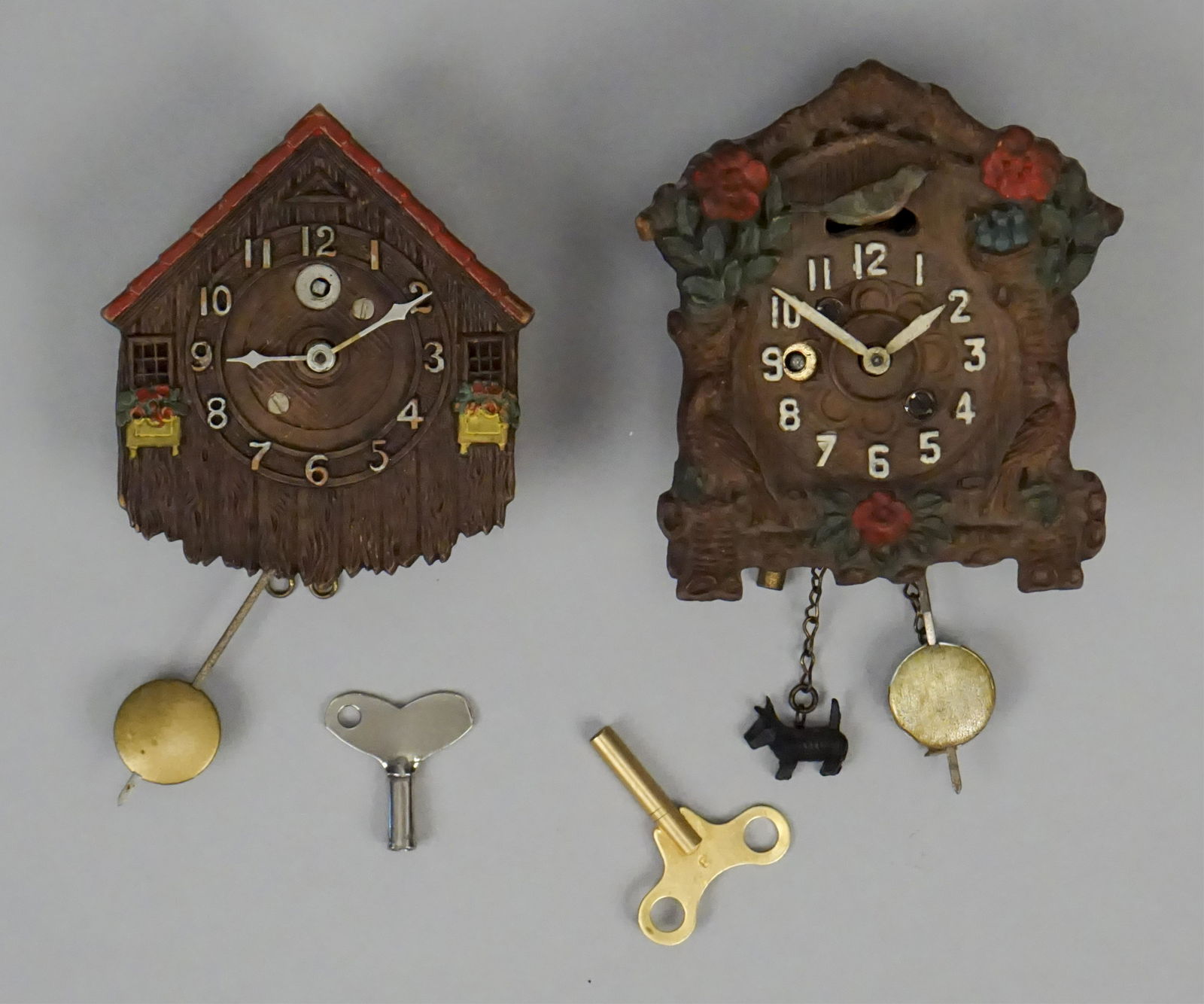 Vintage Mini Lux Wall Clocks with Pendulums & Keys: West German. Lux Clock MFG. Co. - Vintage Lux Keebler Pendulette Wall Clock Animated Bluebird Bird - Made for August C. Keebler Co. Metal "Can". Works. Clock has been serviced and oiled by a professio