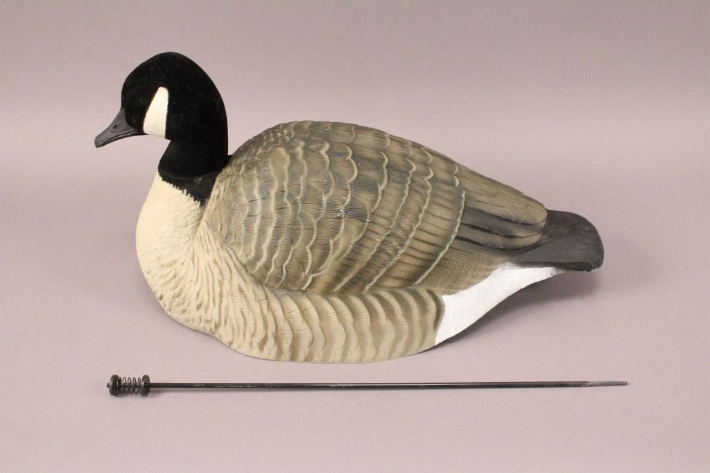 12 Goose Decoys With Portable Carrying Bag: Decoys are marked Green Head Gear oversized goose shell with an Avery Outdoors carry bag. 12 heads, bodies and stakes. Hunter's Specialities. [MDB 108]
