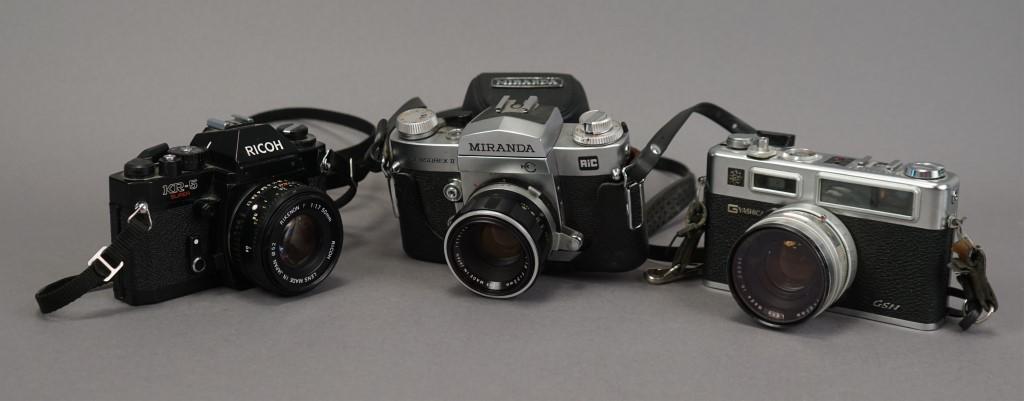 3 Assorted Vintage Cameras - Miranda - Ricoh: Working shutter Miranda M-C, untested meter.. Working shutter Ricoh KR-5 35mm, untested meter. Working shutter Yashica "G" Electro, untested meter. Cindy Sherman. Robert Frank. Eliot Porter. Imogen Cu