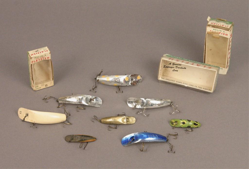Variety of Helin Flatfish Fishing Lures & Boxes: 8 Helin flatfish lures with 3 original boxes and a pamphlet. Some lures included are three U2O (two silver and one blue), T4, & S3. [BED 395]