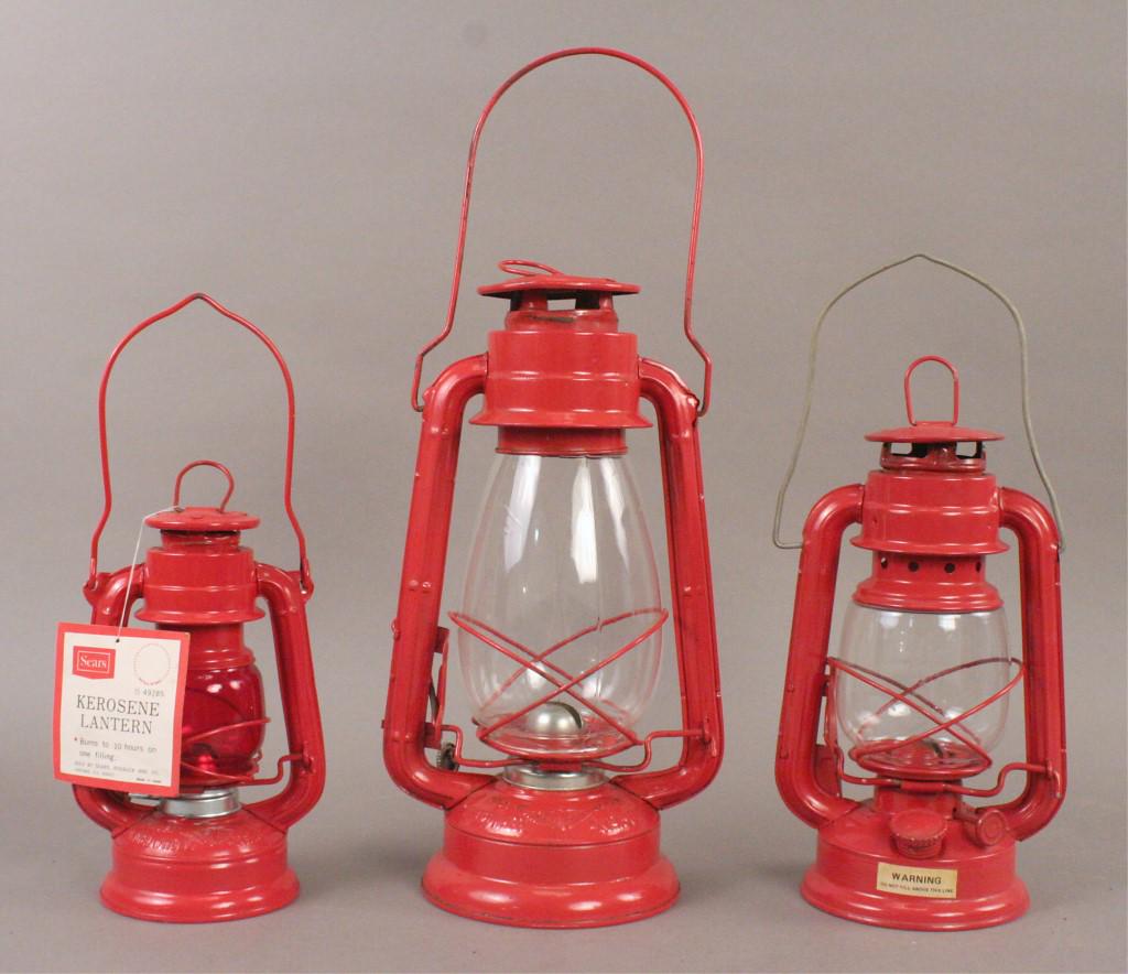 Vintage Redwinged & Sears Kerosene Lanterns: Three vintage red lanterns: Redwinged No. 350, Redwinged No. 500, and Sears - with original tag. [RUD 106]