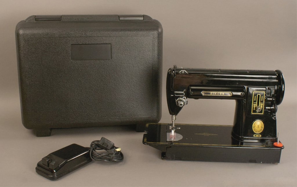 Singer 301 Collectible Sewing Machine: This vintage singer sewing machine was produced in the 1950's. Works, always good to keep oiled. Not the original carrying case, but it came to us with this one. [MIA 328]