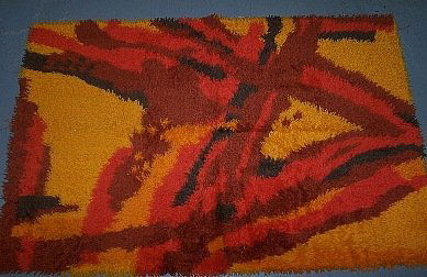 Ege Rya Rug.40" X 60" Rainbow.Yellow/Orange: Ege Rya Rug "Sunburst" with label on the back. It measures 40" X 60" and is in excellent condition. ESTIMATED SHIPPING CHARGES FOR THIS ITEM ARE $18.00 FOR FEDEX GROUND SHIPPING W/ NON-FRAGILE WRAP. T