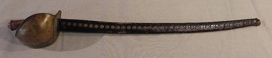 1862 Civil War Naval Sword: Neat old sword. Love the copper rivets in the scabbard that match the rivets on the guard. The blade is stamped with an Anchor above a "P" above "U.S.N." above "D. R" above "1862". On the other side i