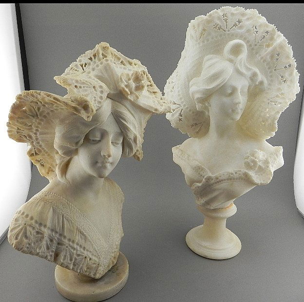 2 Marble Busts.: The taller of the two sculptures is in nice condition and is signed but very faintly. It appears to read "Cipriani". She measures 19 1/2" tall. The shorter bust measures 17" tall and is in fairly roug