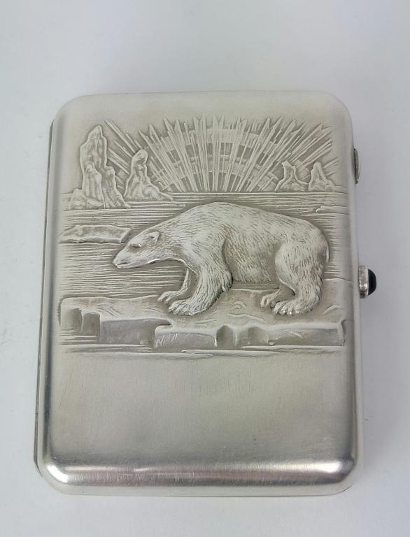 Russian Soviet Silver Cigarette Case: Russian early Soviet Silver Cigarette Case depicting polar bear. Circa 1920 - 30s. Goldwashed interior. Blue stone push button. Weight 163 gm. Size: 4 3/8" x 3 1/4" ( 11 x 8.2 cm ). Hallmarked on both