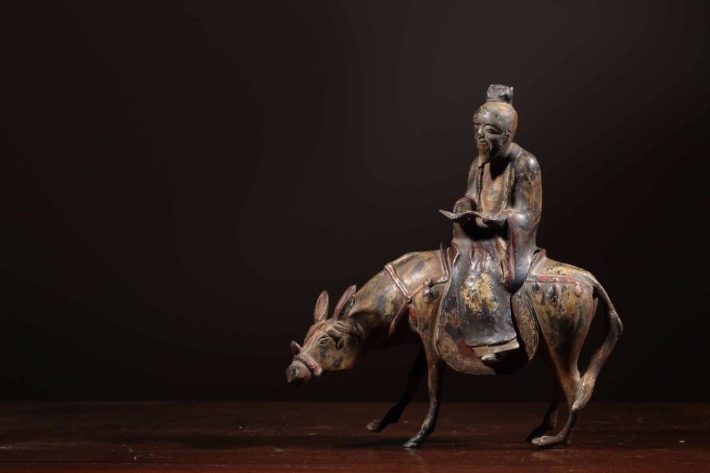 Republican Chinese Bronze Man Ride on Donkey: 22cm L 23cm H 8.8cm W Please note the absence of a condition report does not imply that there are no condition issues with this lot. Please contact us for a detailed condition report.