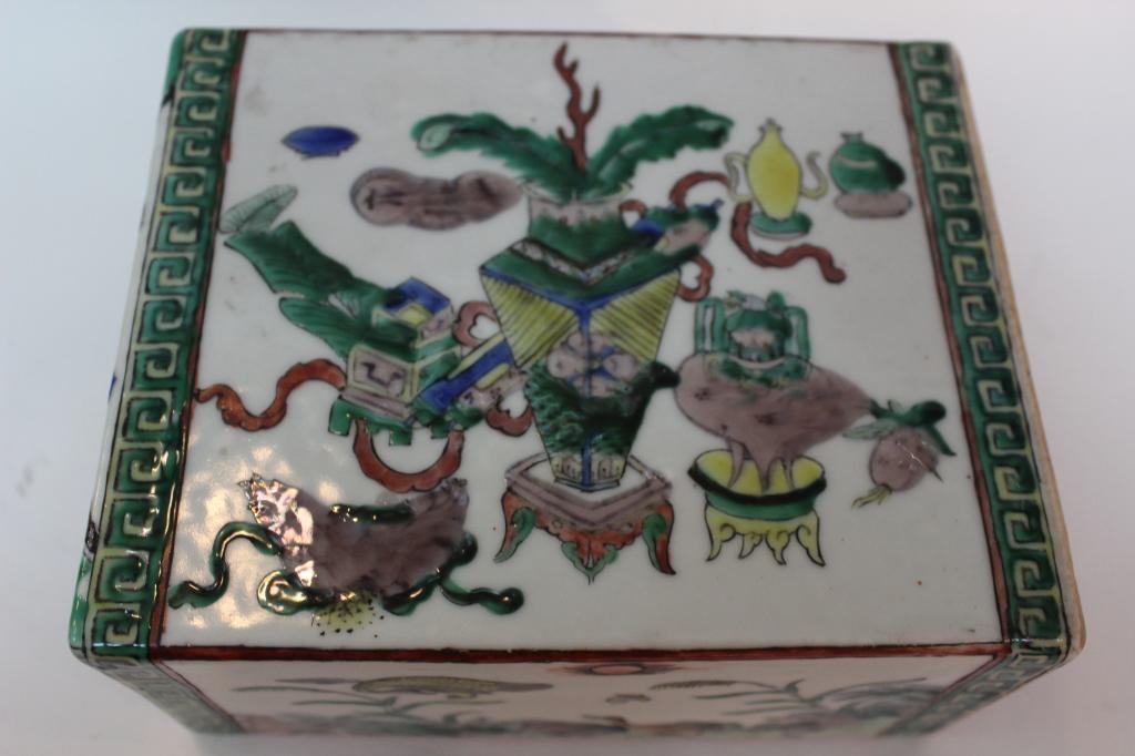 Chinese Famille Rose Porcelain Pillow: 2 3/4" by 6 1/4" Please note the absence of a condition report does not imply that there are no condition issues with this lot. Please contact us for a detailed condition report.