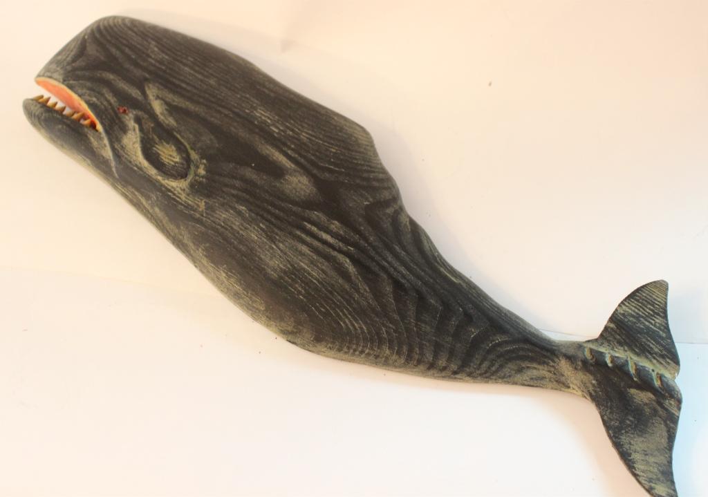 Hand Carved Wood Whale By C.Voorheest: 17 1/2" L 5" W .Carved and painted wooden whale plaque by the master carver Clark Voorhees (1911-1980). Please note the absence of a condition report does not imply that there are no condition issues