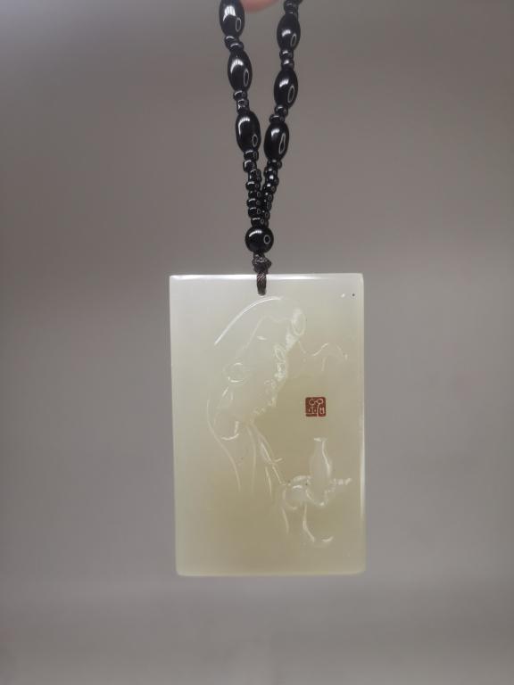 Chinese Jade Plaque: 6.4cm L 4cm W Please note the absence of a condition report does not imply that there are no condition issues with this lot. Please contact us for a detailed condition report.