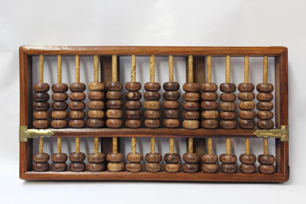 Huanghuali Wood Abacus: 14cm by 27.5cm Please note the absence of a condition report does not imply that there are no condition issues with this lot. Please contact us for a detailed condition report.