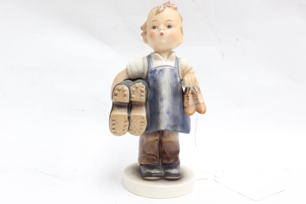 MJ Hummel Boy Holding Boots (1 of 5)