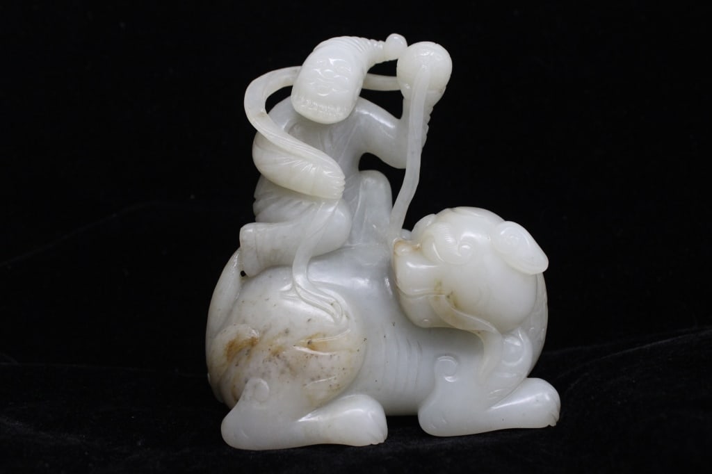 Chinese Jade Carved Huren Ride a mythical Beast: Chinese Jade Carved Huren Ride a mythical Beast. Dimension: 4 1/2" H Please note the absence of a condition report does not imply that there are no condition issues with this lot. Please contact us fo