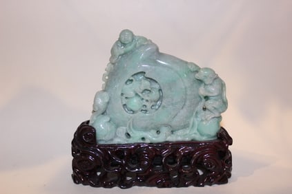 A Jadeite Carved Monkey and Boy Climb on a Peach