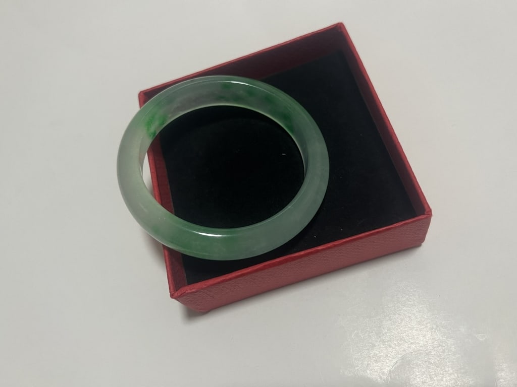a Jadeite Bangle: a Jadeite Bangle