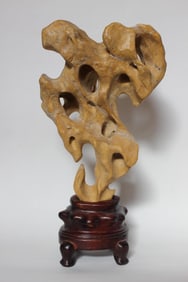 A Scholar Rock Yellow Taihu Stone on Wood Stand