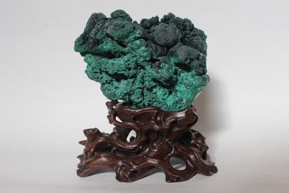 A Malachite Scholar Rock Stone on Wood Stand