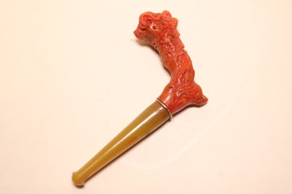 A Coral Carved Zeus Smoking Pipe.