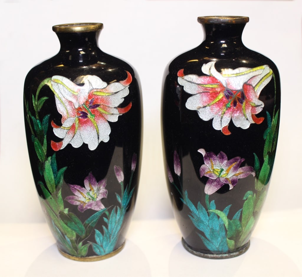 Pair of Japanese Cloisonné Vases.: Pair of Japanese Cloisonné Vases. Dimension: 4 3/4"Tall. They feature a black enamel background with colorful floral designs. The main mot