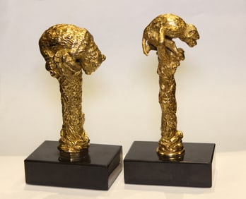 Two small gilt-bronze sculptures mounted on black