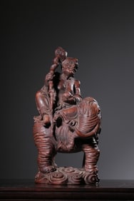 Chinese Carved Buddhist immortal figure riding an