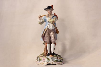 Finely Detailed Porcelain Figurine of a Young Man