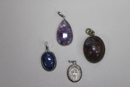Collection of Four Distinct Gemstone Pendants