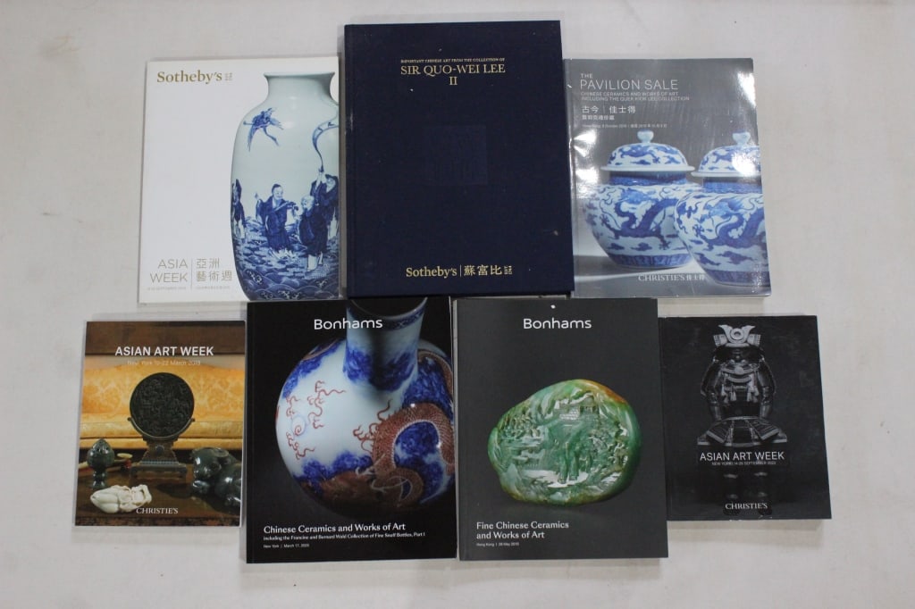 Lots of 7 Auction Catalogs: Sotheby's "Sir Quo-Wei Lee II" Catalogs: The dark blue hardcover book in the top center is a catalog for the second part of an auction series featuring the collection of Sir Quo-Wei Lee. These sales i