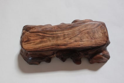 A Carved Hardwood Display Stand.