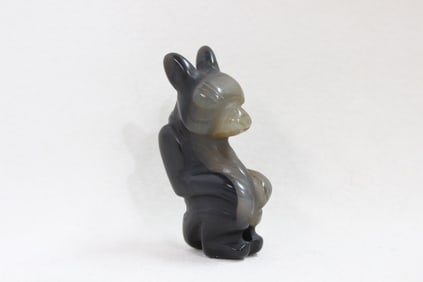 Hand-carved figurine of a French Bulldog