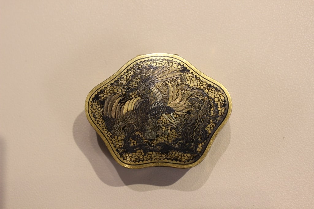 Japanese Damascene Box: Dimension: 2"x 2 1/2". The box is decorated using the traditional Japanese nunome-zogan (damascene) technique, which originated from sword-making. This involves cross-hatching a blackened iron or