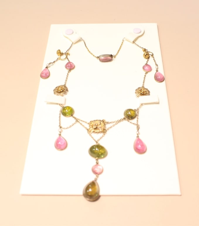 Beautiful Pink and Green Tourmaline Necklace set: Beautiful Pink and Green Tourmaline Necklace and earring set. The primary gemstones are natural tourmalines. The green stones are likely peridot or green tourmaline, while the pink stones are pink