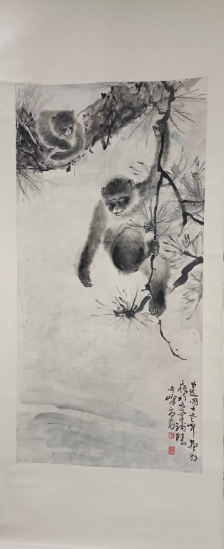 Chinese Ink Painting of monkey: epicts two macaques (a type of monkey) climbing and resting on a pine tree. The dynamic composition features a strong, gnarled trunk contrasting with the softer, "boneless" color washes used for