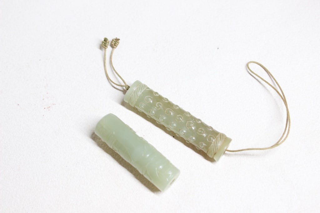 Two Chinese Carved Jade Tubular Pendants or Beads (1 of 6)