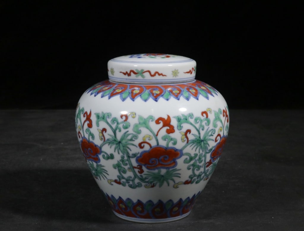 Chinese Hand-Paint Doucai porcelain covered jar: Dimension: 14.5cm H x 14cm w.The jar features scrolling lotus vines (baoxiang hua), a central Buddhist symbol representing purity and spiritual growth. The lid and shoulder are often decorated with