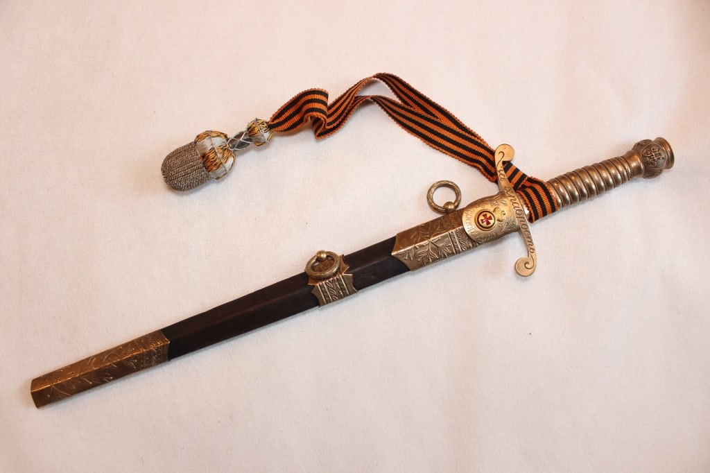 Imperial Russian St.George Award Officer's Dirk: an Imperial Russian St. George Award Officer's Dirk (Naval Dirk), an elite ceremonial and combat weapon typically awarded to officers "For Bravery". Dimension: 12"L / 17"L .