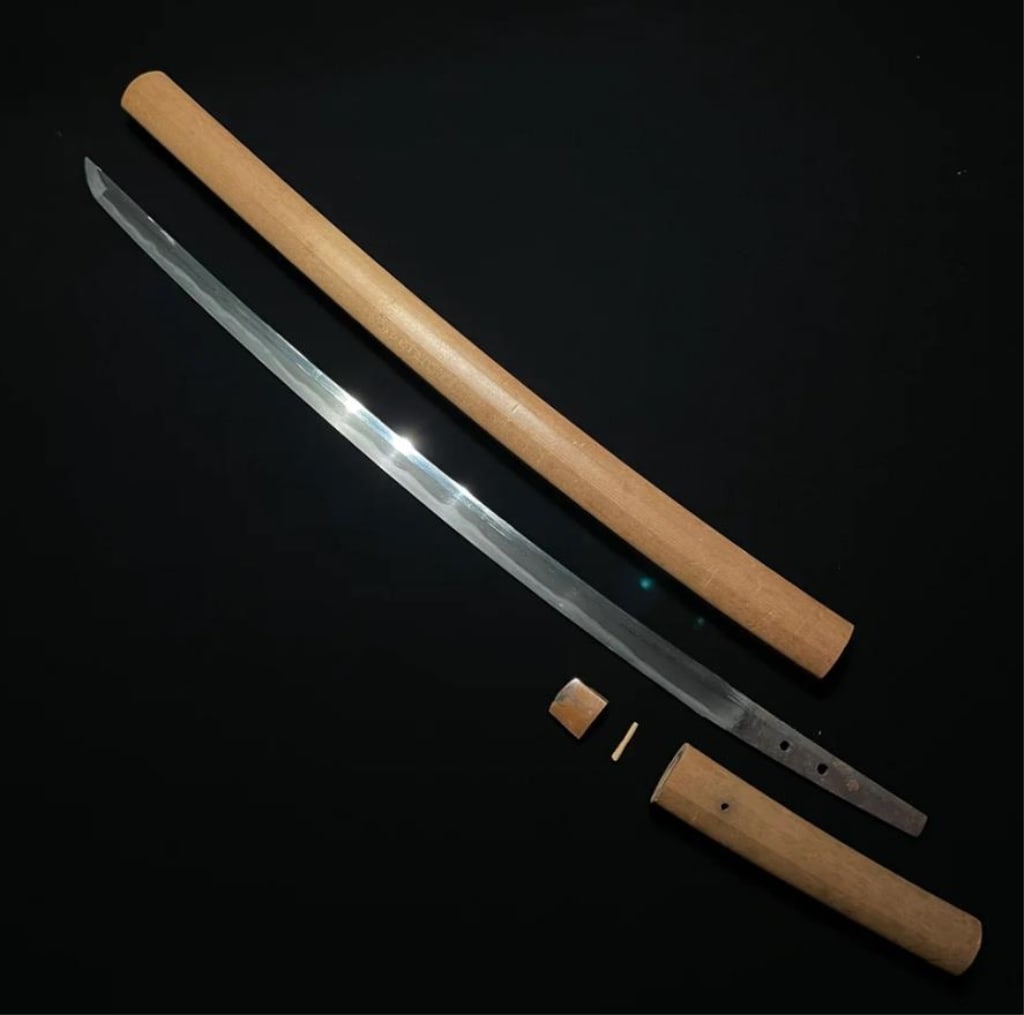 Hizen Masahiro , Long WAKIZASHI, Early Edo period,: Hizen Masahiro , Long WAKIZASHI, Early Edo period, with NBTHK Shinsa paper. The blade is long, slender, and gently curved, with a well-defined shinogi (ridge line) running along its length. The