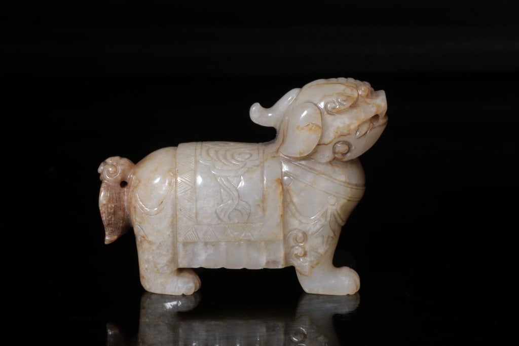 Chinese Carved Jade "Auspicious Beast": Dimension: 5.2cm H x 7.2cm L x 2.2cm,weight is 136gram. The figure represents a standing mythical creature, characterized by a large ears, and a powerful, stocky body.